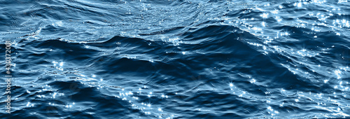abstract background, texture sea blue water, waves and ripples on the ocean, sea pattern wallpaper