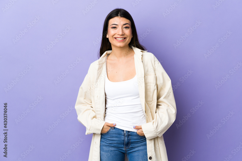 Young brunette woman over isolated purple background laughing Young brunette woman over isolated purple background laughing