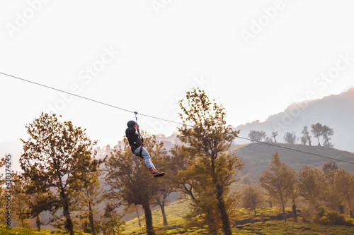 person climbing on a rope