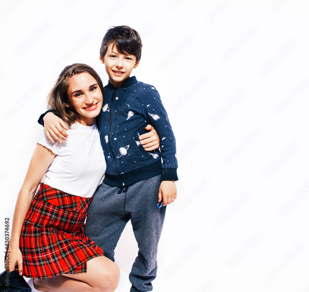 lifestyle and people concept, little cute boy with teenage girl posing together cheerful happy smiling isolated on white background lifestyle and people concept, little cute boy with teenage girl posing together cheerful happy smiling isolated on white background