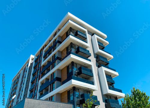 Modern residential building with flats. Contemporary multi store architecture  planned for dwellings and offices.
