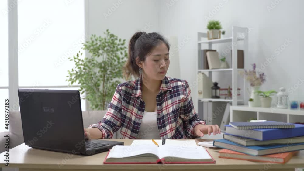 girl using calculator to solve the question girl using calculator to solve the question