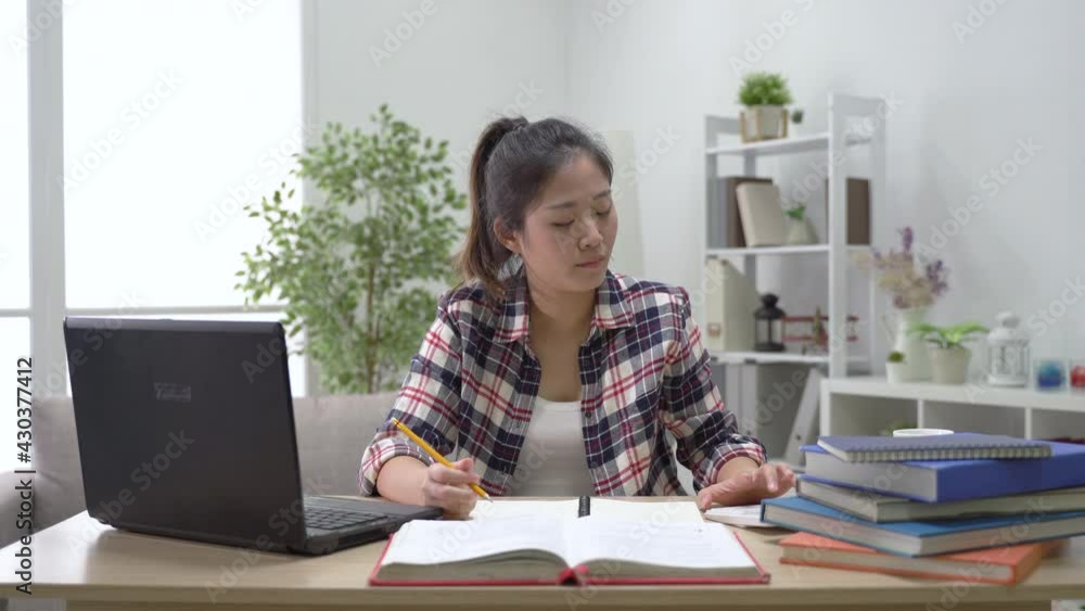 asian female learner underlining key math formula asian female learner underlining key math formula