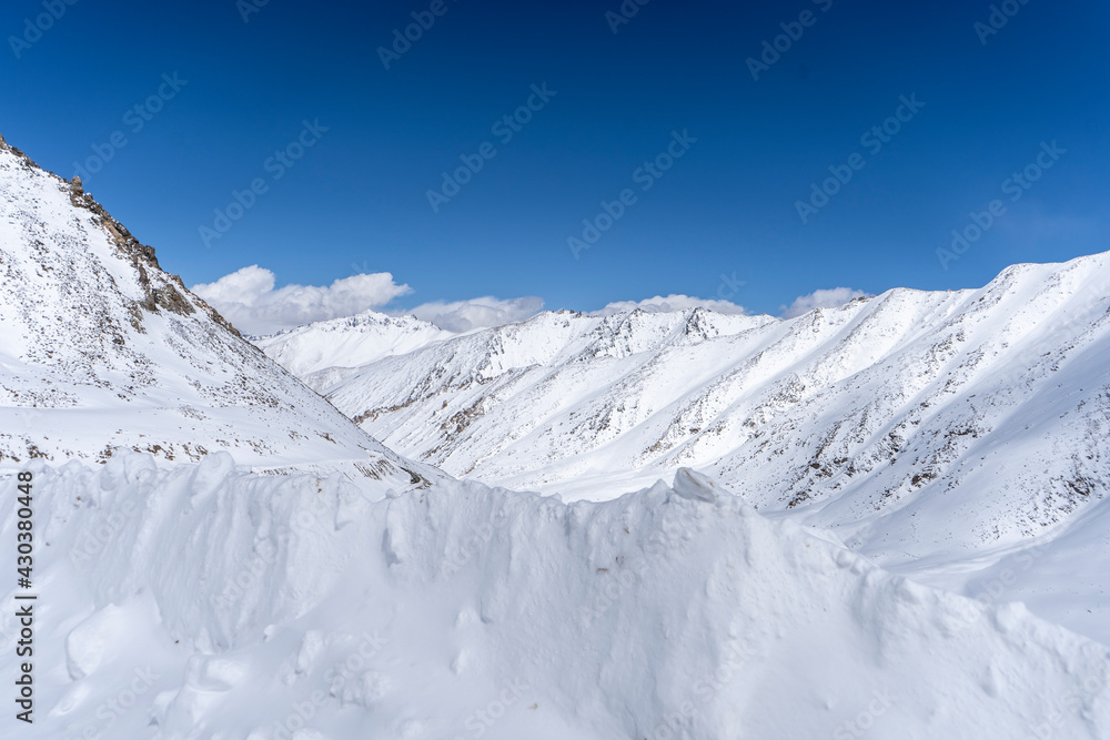 Landscape of Snowy mountain peaks in India. Mountains captured in snow great place for winter sports.