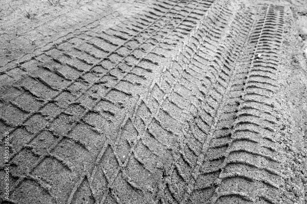 Tyre tracks on sandy dirty road in black and white. Tyre tracks on sandy dirty road in black and white.