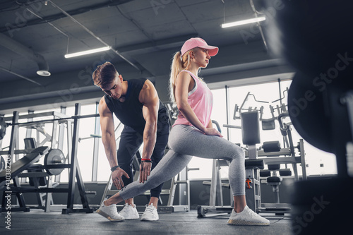 Side view of focused and motivated sporty young girl in sportswe photo