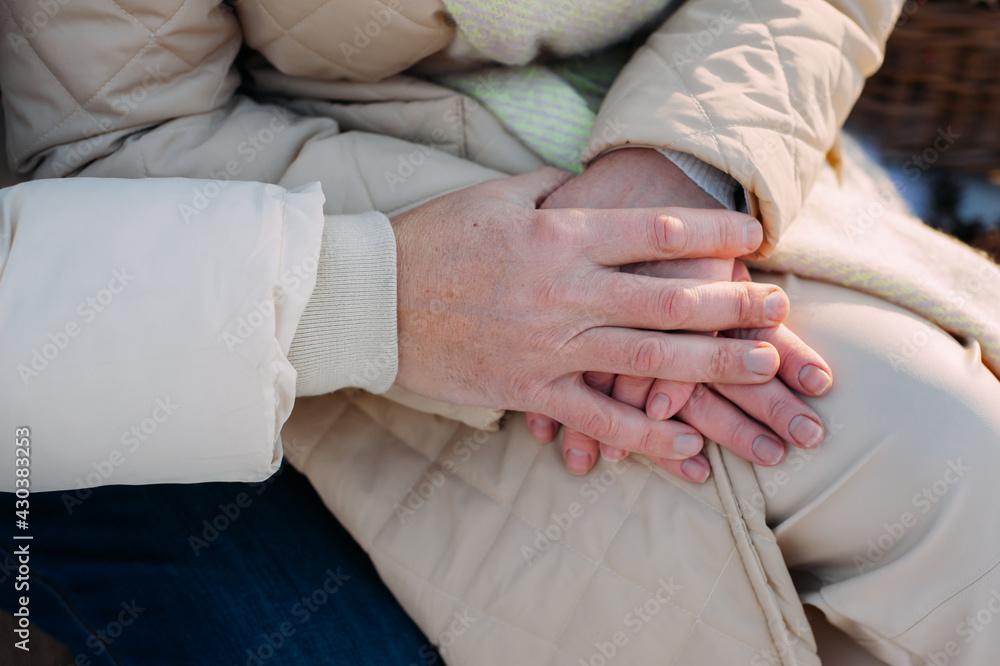 Hands of a man and a woman, support, care. Selective focus.