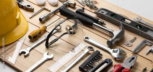 All tools supplies home construction on the wooden table background. Building tool repair equipments. photo