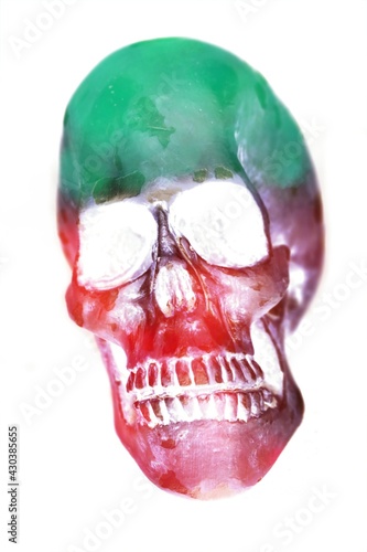 Human green and red skull including teeth. Halloween horror concept. photo