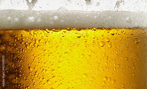 Beer. Light cold craft beer in a glass. Pint of beer close up