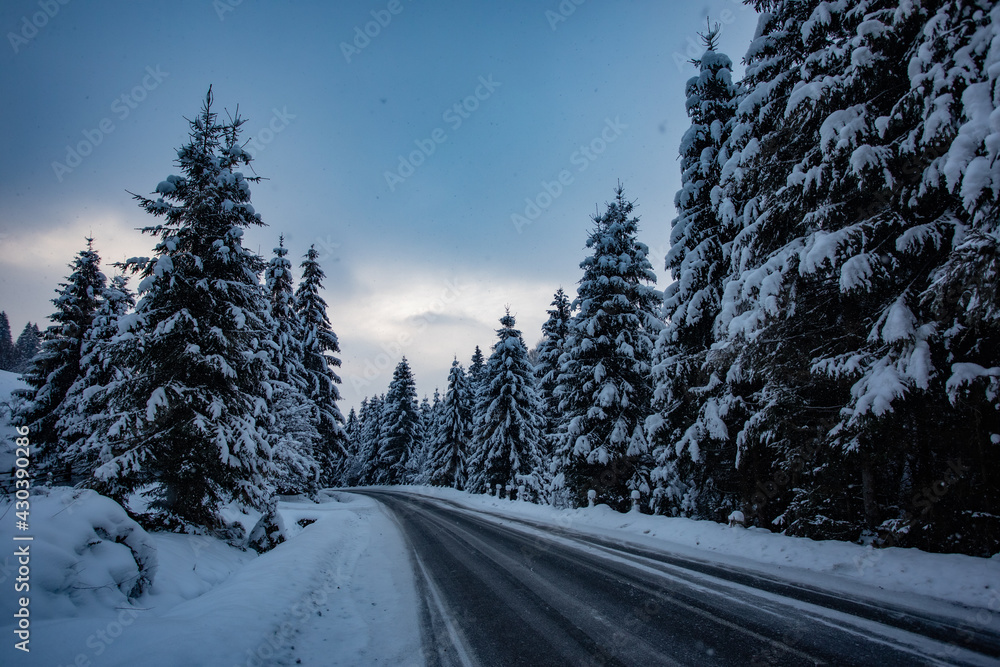 Winter road in the mountains during storm