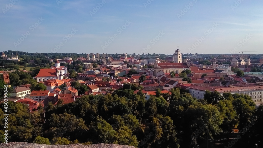 Panorama of the old city. Aerial view from Mount Gedymin to the historic old part of the city of Vilnius in Lithuania. Summer time. Horizontal photo. 