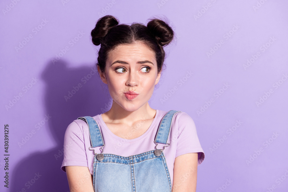 Photo of young attractive girl worried nervous fail mistake look empty space isolated over purple color background Photo of young attractive girl worried nervous fail mistake look empty space isolated over purple color background