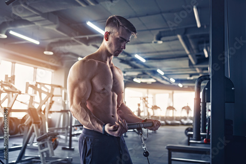 Muscular Fitness Bodybuilder Doing Heavy Weight Exercise For Bic