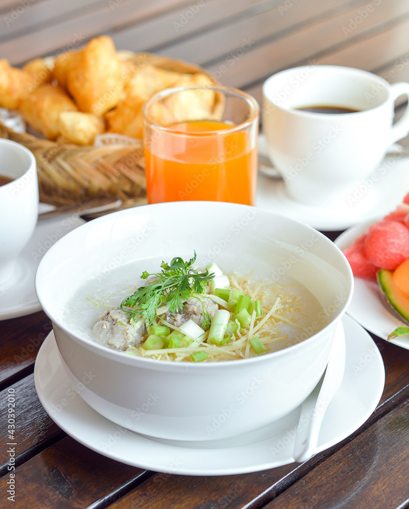 Congee with minced pork served slice ginger coriander and egg ,Asian Food breakfast Congee with minced pork served slice ginger coriander and egg ,Asian Food breakfast
