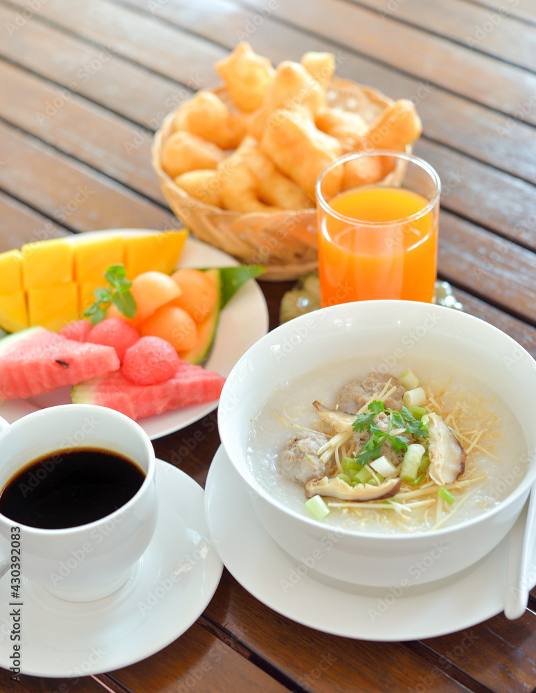 Congee with minced pork served slice ginger coriander and egg ,Asian Food breakfast Congee with minced pork served slice ginger coriander and egg ,Asian Food breakfast