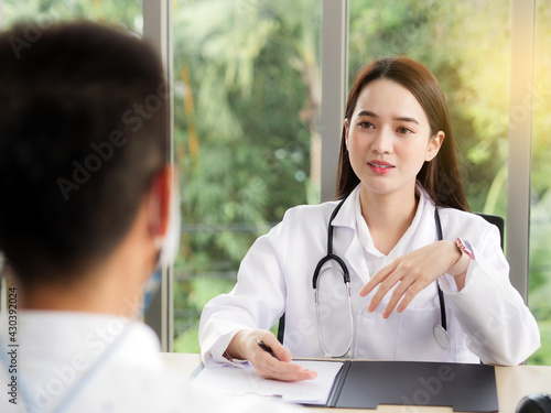 A female doctor or nurse is talking or interview a male patient, ideas for healthcare concepts.