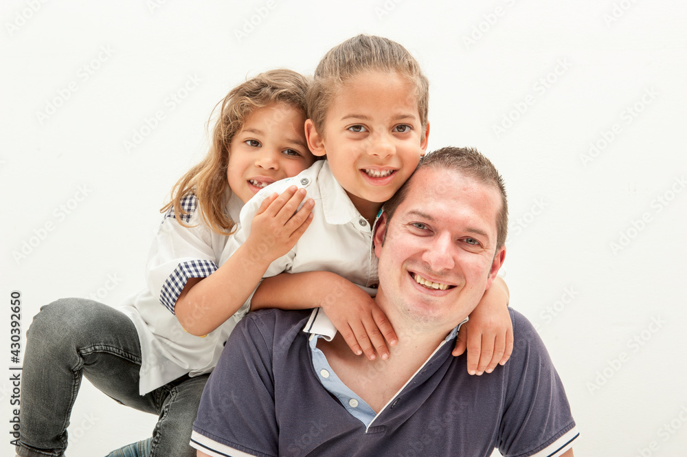 Happy dad plays with little multi-ethnic children Happy dad plays with little multi-ethnic children