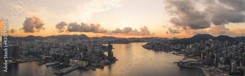 Fotografie Hong Kong - 29 July 2020: Panoramic aerial View of Hong Kong Victoria Harbour at Sunrise, Central and Western District, Hong Kong