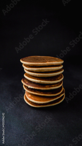 Pancakes on a black background.
