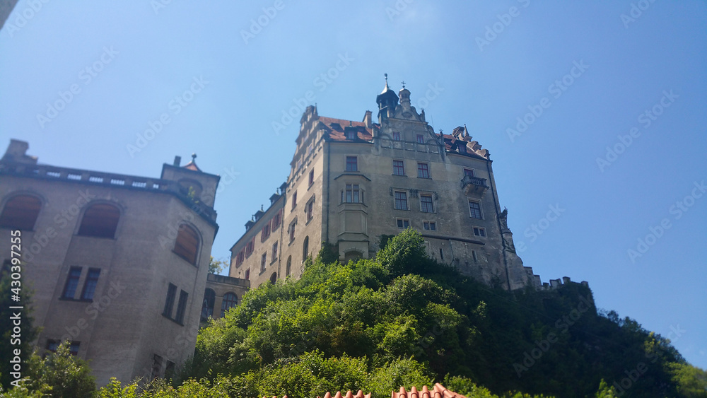 Sigmaringen, Germany - June 25, 2020: Sigmaringen castle in the Baden-Wurttemberg. Residence of the Hohenzollern earls and princes. It stands on the hill known as Castle Rock. Sunny summer day.