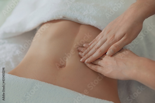 Woman receiving professional belly massage  closeup view