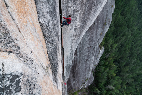 Canada, British Columbia, Squamish, Man rock climbing photo