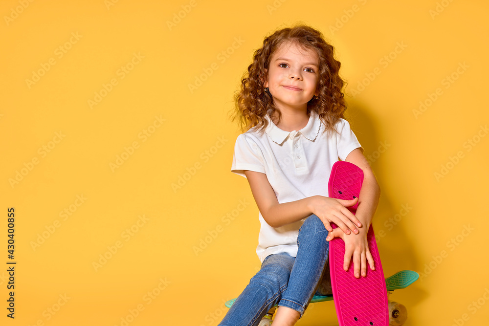 Active and happy Kid having fun with penny board, smiling face s Active and happy Kid having fun with penny board, smiling face s