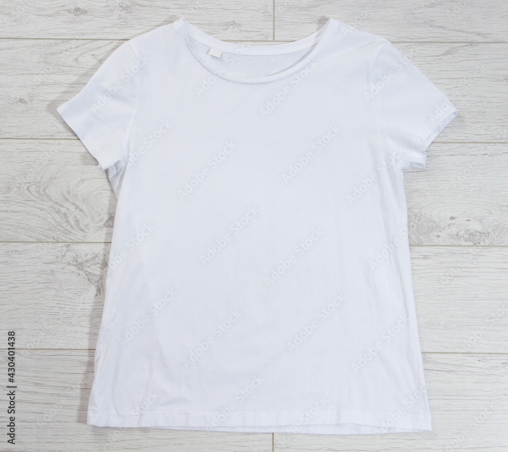 White t-shirt mock up top view background empty shirt White t-shirt mock up top view background empty shirt