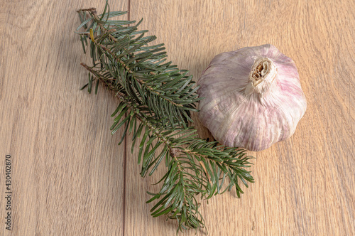 garlic head and rosemary leaves
