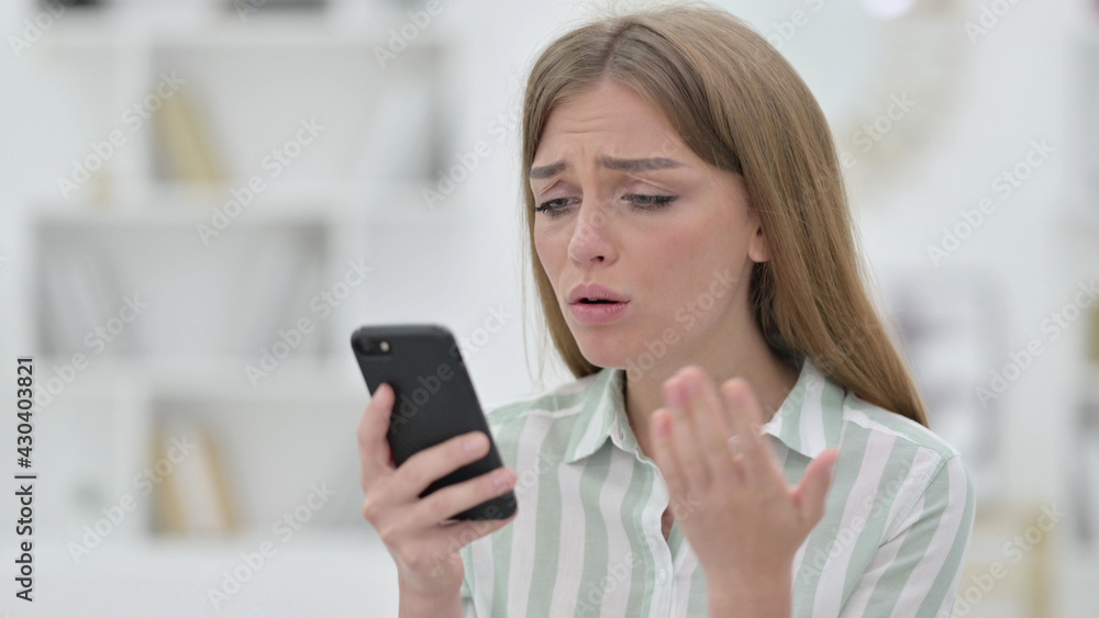 Portrait of Upset Young Woman having Loss on Smartphone Portrait of Upset Young Woman having Loss on Smartphone