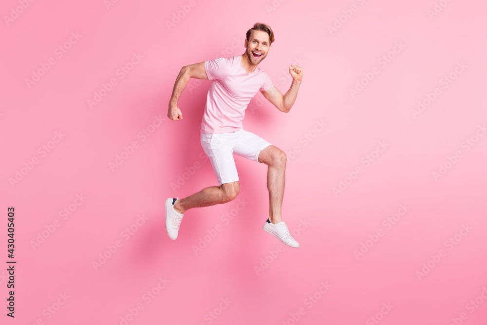 Full length profile portrait of energetic person hurry toothy smile look camera isolated on pink color background