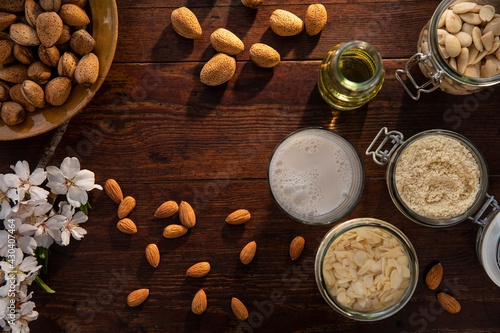 Spain, Baleares, Almonds and almond products on wooden table photo