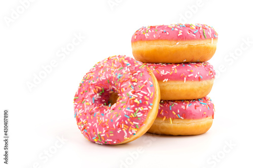 Fresh made Donuts isolated on white background. Doughnuts are traditional sweet pastries. Copy space for text.