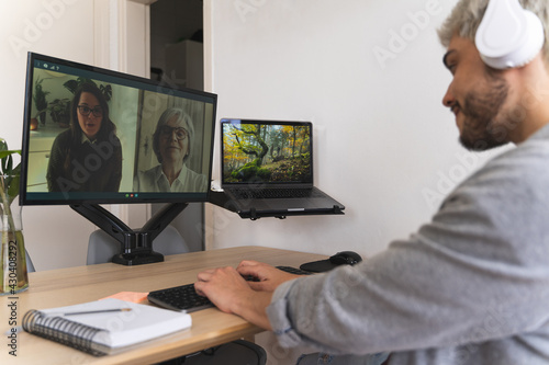 Three people video-conferencing to work at home