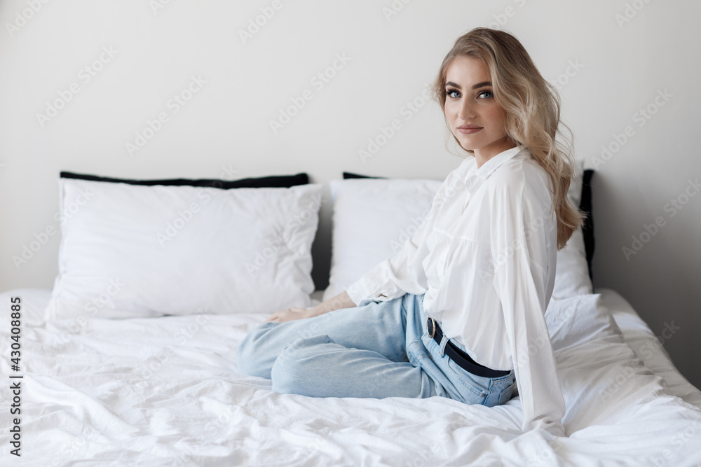 Portrait of a happy young woman indoor on bed Portrait of a happy young woman indoor on bed