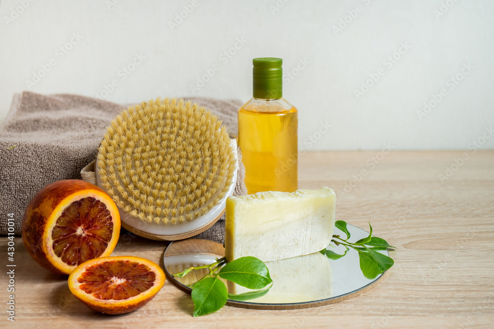 Ecologic concept. Spa still life with essential oil, hand made soap and dry massage brush. Zero waste products for personal care