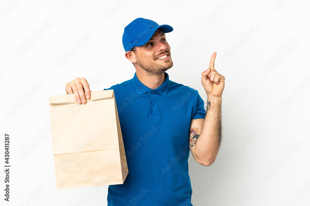 Brazilian taking a bag of takeaway food isolated on white background pointing up a great idea Brazilian taking a bag of takeaway food isolated on white background pointing up a great idea