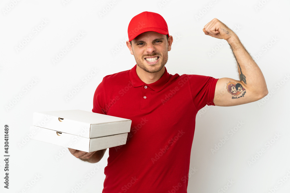 pizza delivery man with work uniform picking up pizza boxes over isolated  white wall doing strong gesture