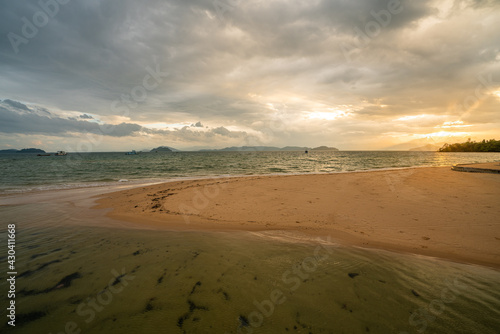 White sand beach in Phayam Island at sunset, Ranong, Thailand.