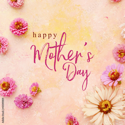 Vászonkép Square background with flat lay of zinnia flower blooms on light pink pastel texture with Happy Mother's day text for holiday graphic card