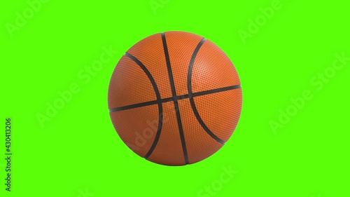 Side on view of a 3D basketball rolling from left to right. Standard orange basket ball in a continuous roll perfect for sports advertising. 4K clip at 60fps for smooth motion with an alpha matte  photo