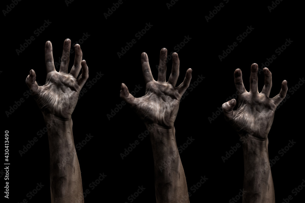 Set of dirty creepy zombies hands with different posing isolated on black. 