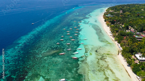 Aerial view of tropical beach on the island Panglao, Philippines. Seascape with beach. © Alex Traveler