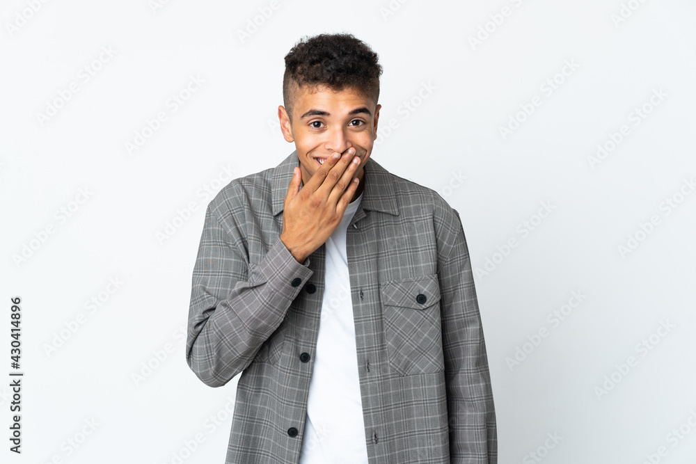 Young brazilian man isolated on white background happy and smiling covering mouth with hand Young brazilian man isolated on white background happy and smiling covering mouth with hand