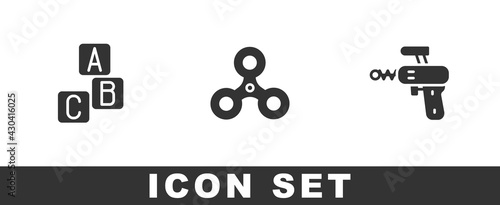 Set ABC blocks, Fidget spinner and Ray gun icon. Vector