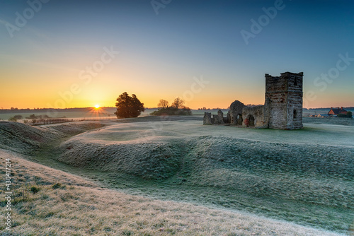 Frosty sunrise over the old church at Knowlton photo