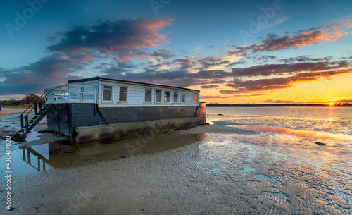Dramatic sunset over a houseboat in Bramble Bush Bay photo