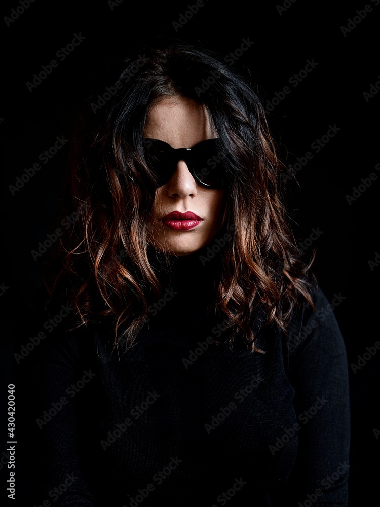 beautiful young woman in black clothes with nice red lips beautiful young woman in black clothes with nice red lips