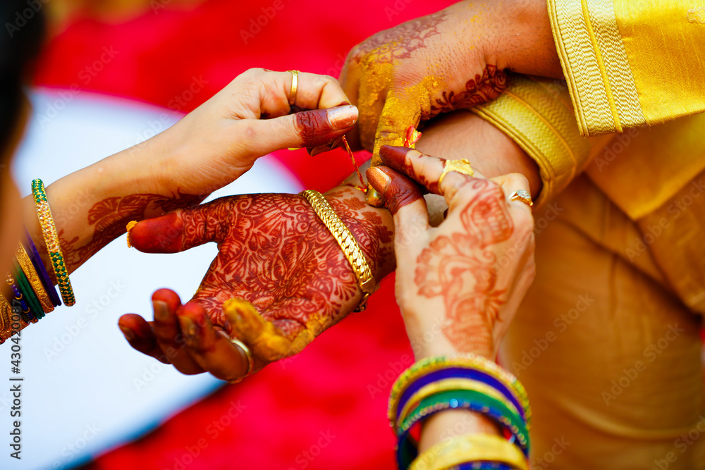 Indian Traditional Wedding: Groom hand in haldi ceremony